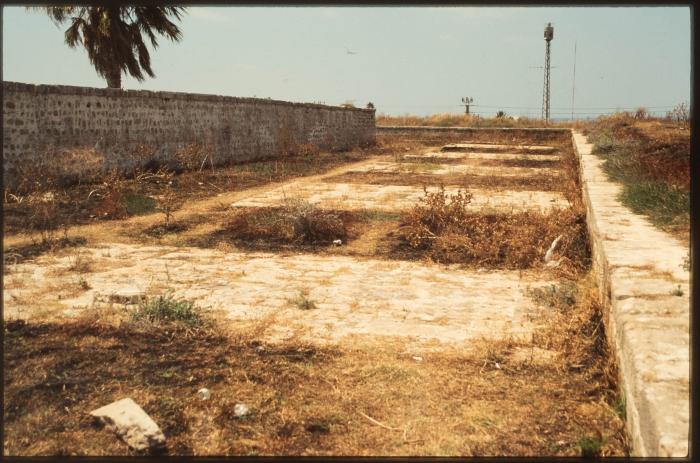A Photograph of the Remains of an Archaeological Site and Wall in the Occupied City of Acre in the 1990s