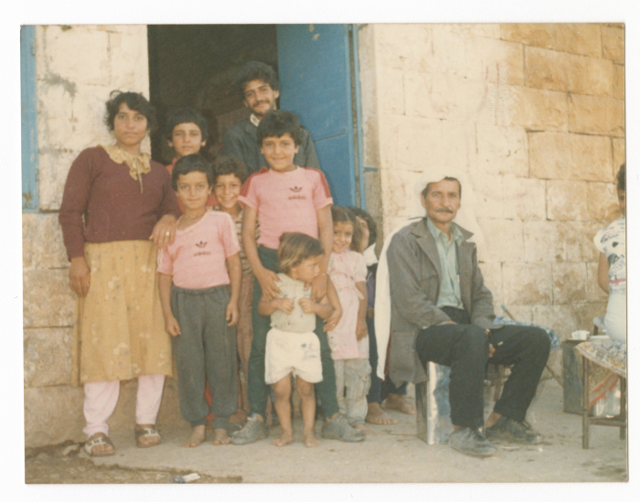 Khaled Qasem; a farmer from Kufeir village, with his family