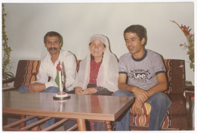 A former prisoner and his mother with a friend of theirs