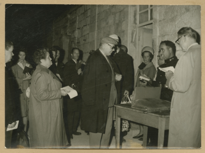 Checking tourists' passports at the Mandelbaum Gate