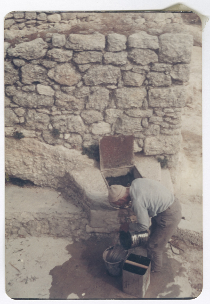 A man filling up water