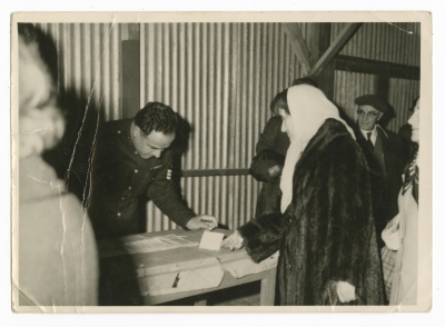 A captain in the Jordanian army checks a woman