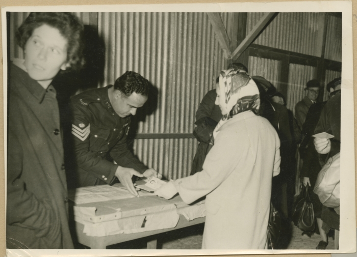 Checking visitors' passports at the Mandelbaum Gate