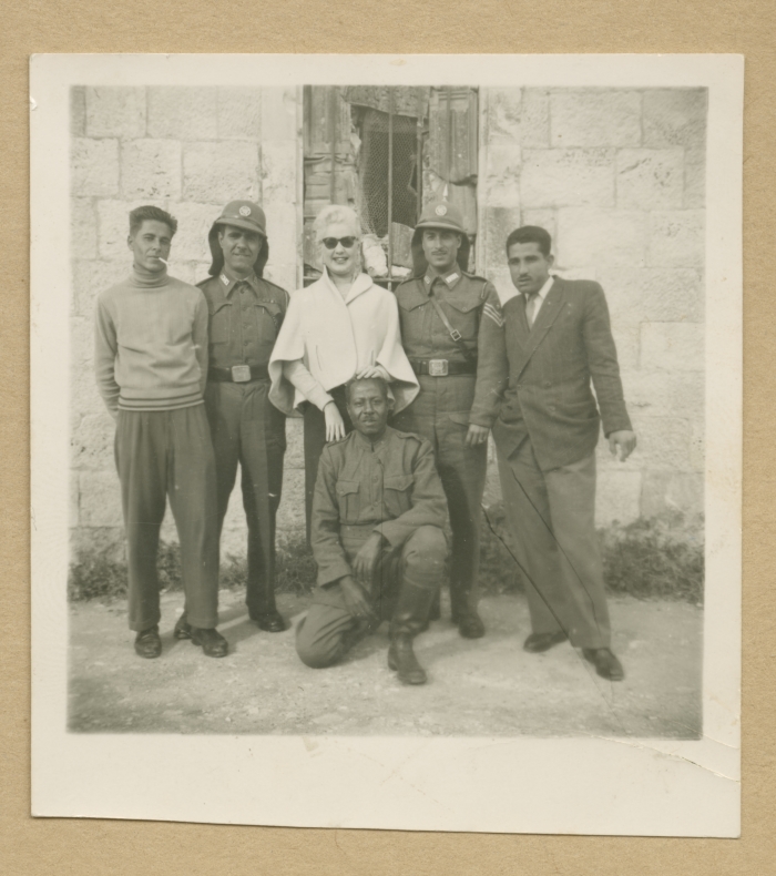 Visitors with security guards at the Mandelbaum Gate