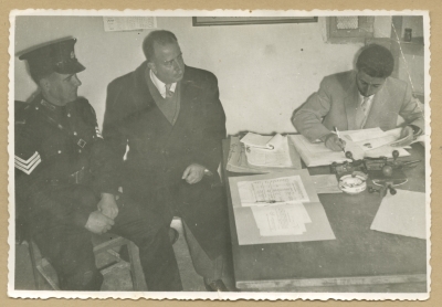 Checking passports at the Mandelbaum Gate