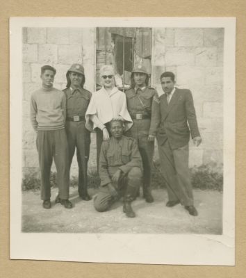 Visitors with security guards at the Mandelbaum Gate