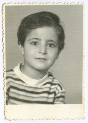 A studio portrait of a child from Diab Family, in Amman