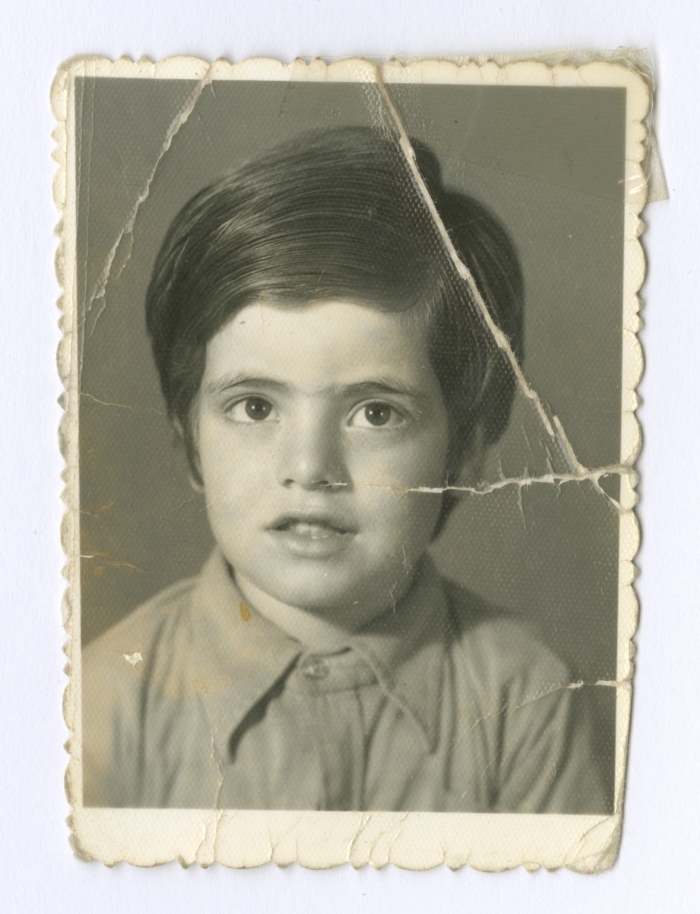 A studio portrait of a child from Diab Family, in Amman