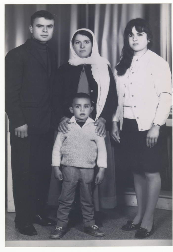 A studio group portrait of the Dagher Family in Ramallah