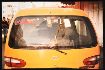 Religious Phrases Printed on a Public Taxi