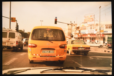 Religious Phrases Printed on a Public Taxi