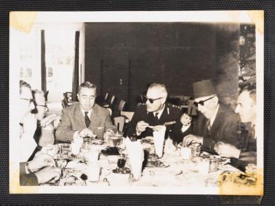 Anwar Nusseibeh with Others at a Dining Table 