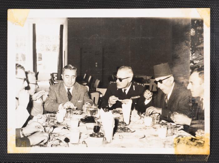 Anwar Nusseibeh with Others at a Dining Table 