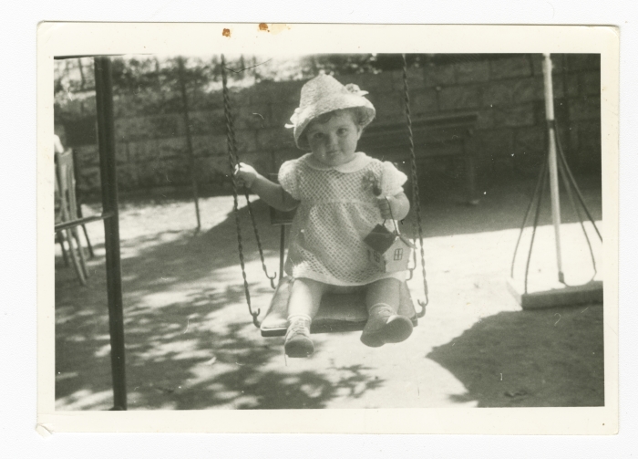 Samia Joubran Playing on a Swing Set 