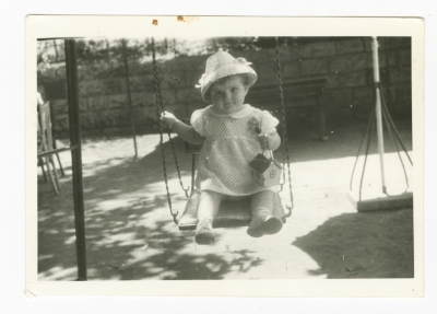 Samia Joubran Playing on a Swing Set 
