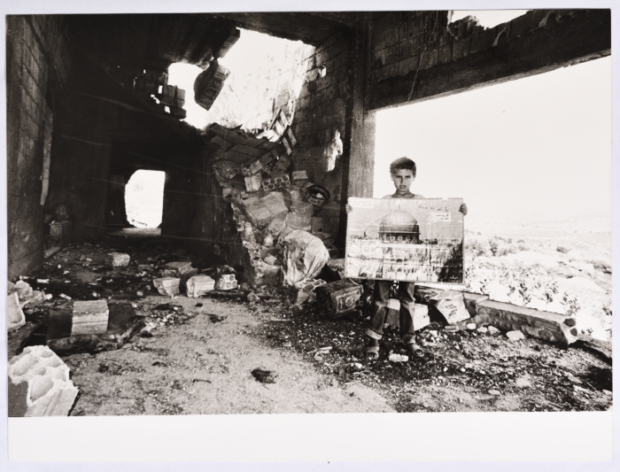 A Child in a Refugee Camp in Southern Lebanon Holding a Photo of Al-Aqsa Mosque