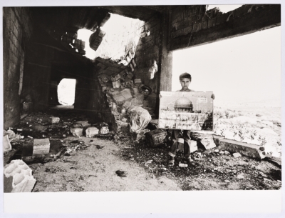 A Child in a Refugee Camp in Southern Lebanon Holding a Photo of Al-Aqsa Mosque