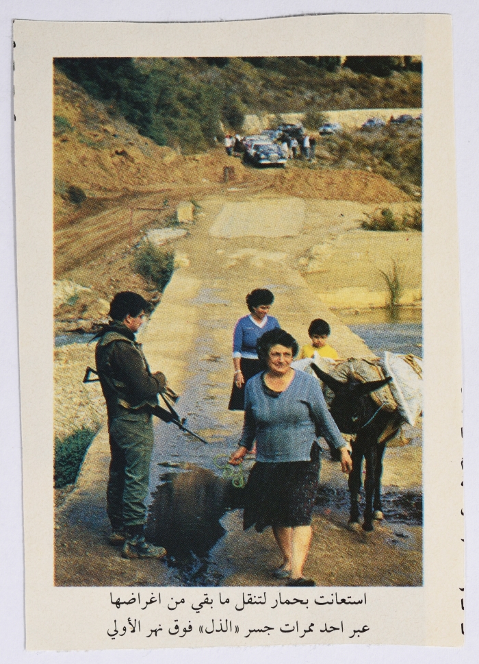 A Woman Passing a Military Barrier After the Invasion 