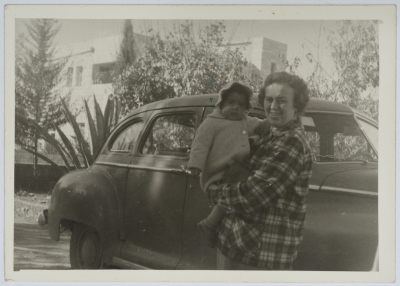 A Supervisor at the Evangelical Home and School in Ramallah Holding a Child 