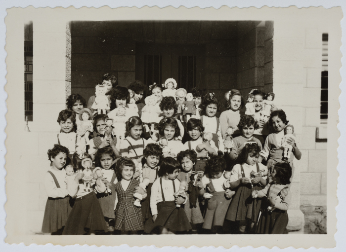 Girls at the Evangelical Home and School in Ramallah Carry Dolls on Christmas