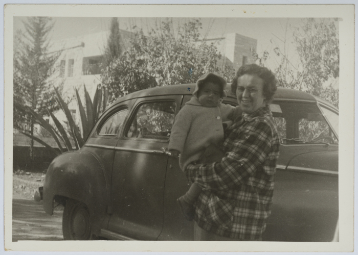 A Supervisor at the Evangelical Home and School in Ramallah Holding a Child 
