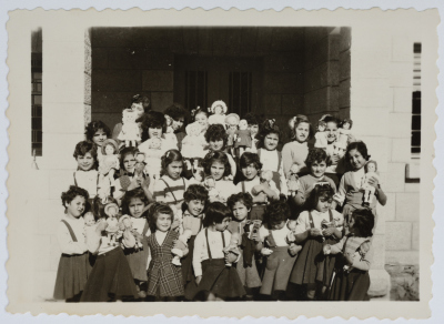 Girls at the Evangelical Home and School in Ramallah Carry Dolls on Christmas