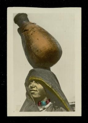 A Palestinian Woman Carrying a Jug of Water on Her Head, the 1920s 