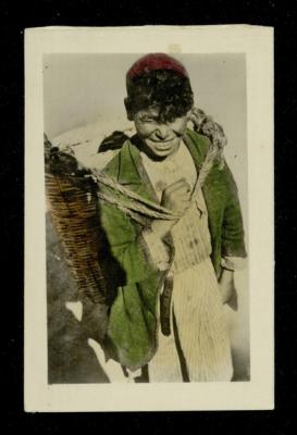 A Palestinian Bedouin Child Carrying a Straw Basket, the 1920s