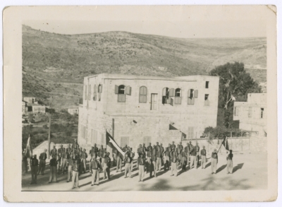 Members of an-Najjada Organisation Saluting the Flag
