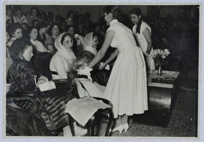 Handing flowers to a lady