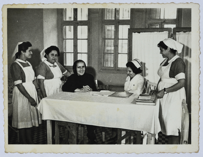 Head of the Arab Women Union Society at the old building of the Society's hospital