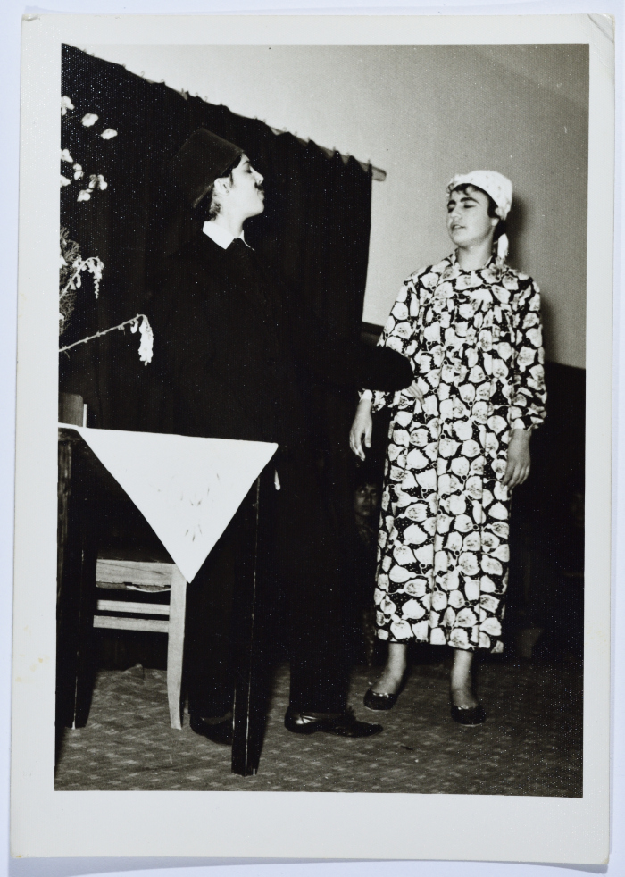 Two students from Dar al-Yatemat during a theatrical performance at Homecoming