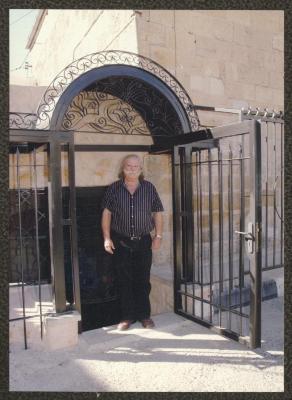 Adel Tartir in front of the "Wonder Box" Theatre Headquarters, Ramallah, 2004