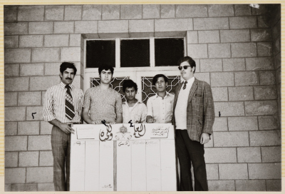 Students from the Arab Institute in Abu Dis holding a wall magazine of their production