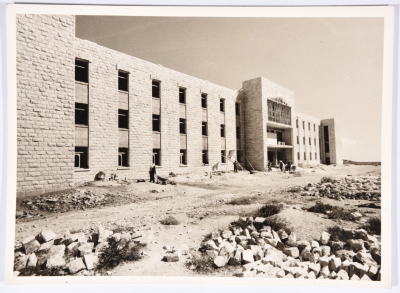 The southern façade of the Manama building at the Arab Institute in Abu Dis during construction