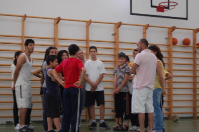 A Photograph of the PCS Basketball Team with their Coach