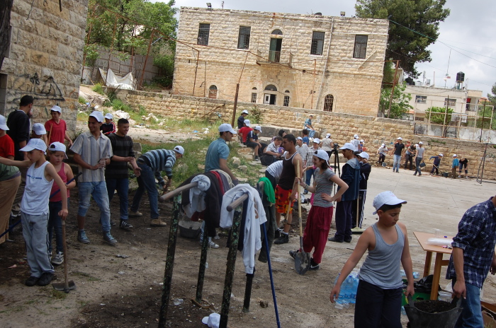 Cleaning the Palestinian Circus School's Building Before its Renovation in the Town of Birzeit 