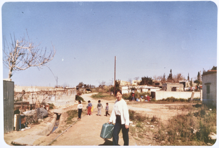 A Volunteer With a Water Container in Al-Rashideyeh Refugee Camp