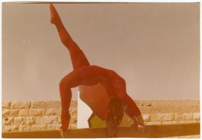 Samar Qassis Performing Gymnastics on a Beam, Birzeit College, 1974