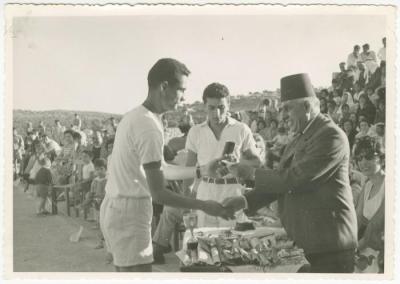 Musa Naser Distributing Awards to Winners at a Sports Show, Birzeit College, 1961