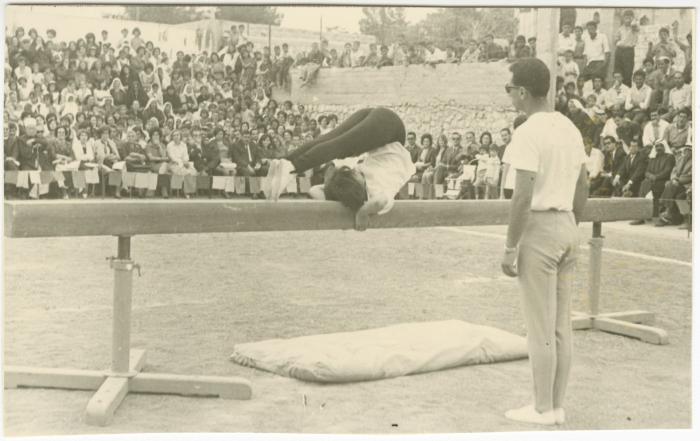 A Student Performing Gymnastics on a Beam, Birzeit College, 1966