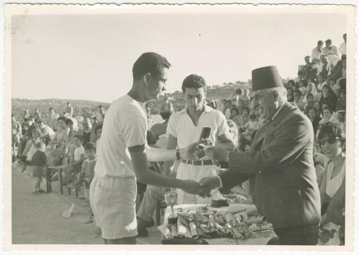 Musa Naser Distributing Awards to Winners at a Sports Show, Birzeit College, 1961