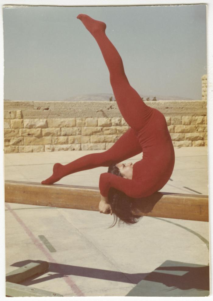 Norma Zaghloul Performing Gymnastics on a Beam, Birzeit College, 1974
