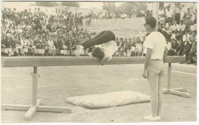 A Student Performing Gymnastics on a Beam, Birzeit College, 1966