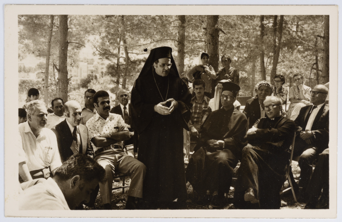 A Preist Giving a Speech 