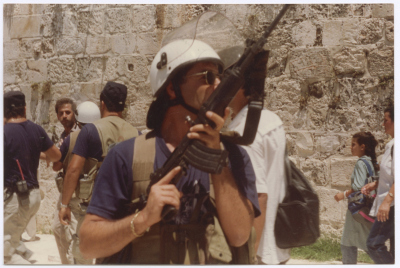 An IOF Soldier Carrying a Gun at Shaheed Omar al-Qasim