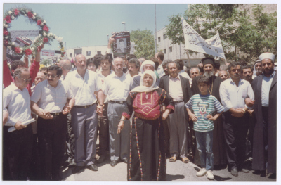 An Elderly Palestinian Woman at the Front of Shaheed Omar al-Qasim