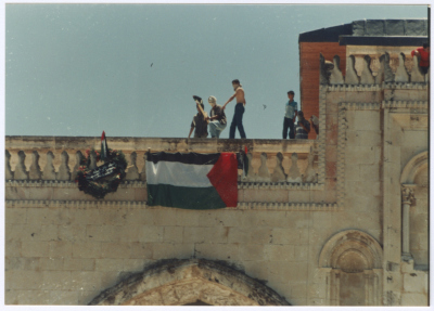 Youths Raising the Palestinian Flag on Top of al-Aqsa Mosque