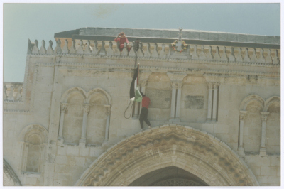 Two Youths Raising the Palestinian Flag on Top of al-Aqsa Mosque