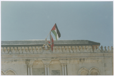 A Youth Raising the Palestinian Flag on Top of the al-Aqsa Mosque Walls, Jerusalem, 6 June 1989